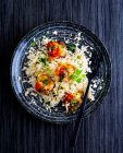 Cauliflower rice with gratinated chicken medallions — Stock Photo