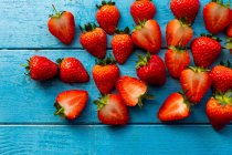 Strawberries on a blue background — Stock Photo