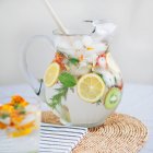Mineral water infused with fruit, herbs and flowers — Stock Photo