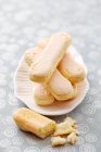 Ladyfingers on a plate — Stock Photo
