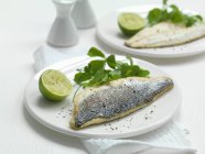 Seabass fillets with pepper and lime — Stock Photo