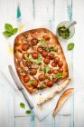 Focaccia with vine ripened tomatoes and pesto dressing — Foto stock