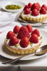 Strawberry tartlets with yogurt cream — Stock Photo