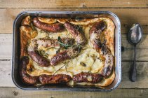 Toad in the hole (sausages baked in batter, England) — стокове фото