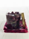 Lacto fermented olives with sage in a mason jar — Stock Photo