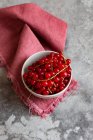 Fresh ripe red cherry on a gray background. selective focus. — Stock Photo