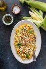 Mexican street corn, elote with cotija cheese, fresh cilantro and chili — Stock Photo