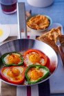 Peppers filled with fried eggs — Stock Photo