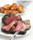 Roast beef with Yorkshire puddings — Stock Photo