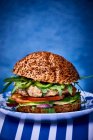 Chicken burger with avocado and rocket — Stock Photo