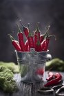 Red chilli peppers in a small bucket — Stock Photo
