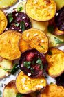Potato, sweet potato and beetroot crisps with sea salt and herbs — Stock Photo