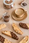 Italian almond cookies cantucci with dark chocolate and coffee — Stock Photo
