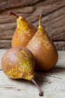 Ripe pears on wooden background — Stock Photo