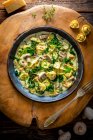 Close-up shot of delicious Tortellini soup with mushrooms — Stock Photo