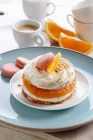 Mini cake with orange mousse and meringue — Stock Photo