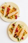 Waffles, berries and honey for breakfast — Stock Photo