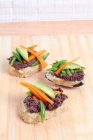 Rice bread with adzuki bean cream, carrot sticks and avocado — Stock Photo