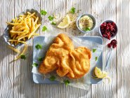 Wiener schnitzel with french fries and dips — Stock Photo