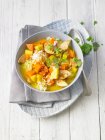 Chicken stew with rice, carrots, potatoes and coriander greens — Stock Photo