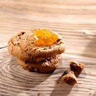 A stack of chocolate chip cookies with apricot jam — Stock Photo