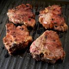 Lamb patties on grill pan — Stock Photo