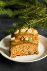 Christmas fruit cake with nuts, spices and sweet fruits — Stock Photo