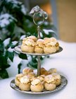Small profiteroles on a cake stand — Stock Photo