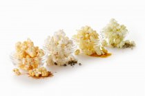 Popcorn flavoured with different spices — Stock Photo