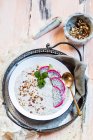 A smoothie bowl with yoghurt, chia seeds, dragon fruit and roasted hazelnuts — Stock Photo