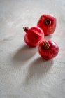 Ripe red pomegranate on a wooden background — Stock Photo