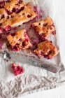 Cherry pie on parchment and linen napkin — Stock Photo