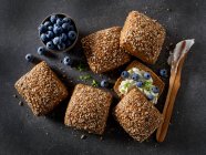 Multi-grain rolls with cream cheese and blueberries — Stock Photo