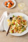 Pappardelle pasta with cod, tomatoes and olives — Stock Photo