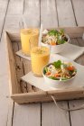 Marinated vegetables with rice noodles and mango lassi — Stock Photo