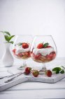 Vegan strawberry tiramisu with yoghurt cream in glasses — Stock Photo