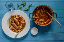 Stew with beans and sausages — Stock Photo