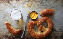 Pretzels with mustard and beer — Stock Photo
