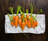 Small garden carrots in different shapes and sizes — Stock Photo