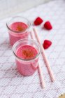 Two glasses of raspberry shake with cinnamon — Stock Photo