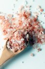 Himalayan pink salt on wooden spoon — Stock Photo