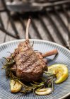 Grilled rack of lamb with rosemary, lemon and garlic — Stock Photo