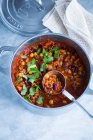 Chili con carne with beans and chickpeas in a saucepan — Stock Photo