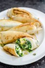 Squid, filled with spinach, potatoes, peas and onions — Stock Photo