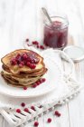 Spinach pancakes with cranberry jam — Stock Photo