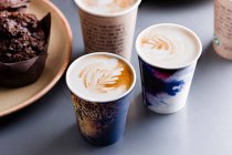 Flat whites in two paper cups (Australia) — Stock Photo