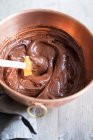 Chocolate cream in a copper mixing bowl — Stock Photo
