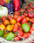 Various tomatoes at a market — Stock Photo