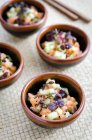 Fresh salmon and tuna ceviche with sesame seeds and herbs — Stock Photo