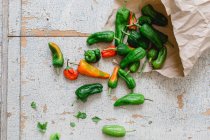 Fresh pimiento peppers in a paper bag (top view) — Stock Photo